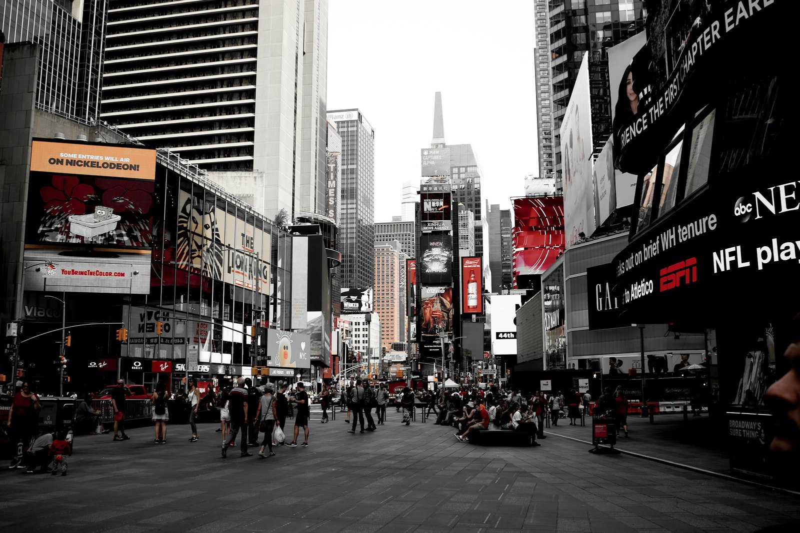Dynamic scene of Times Square showcasing bustling urban life and iconic billboards in New York City.